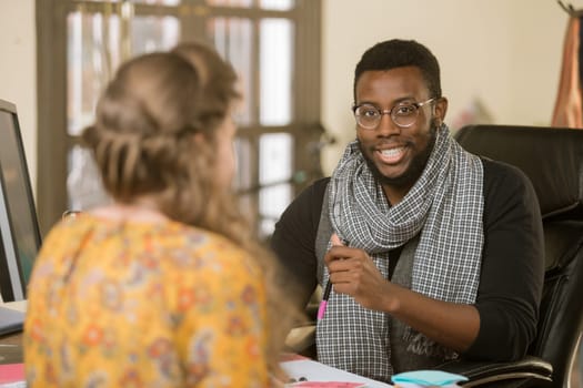 African American man in an office with client or coleague