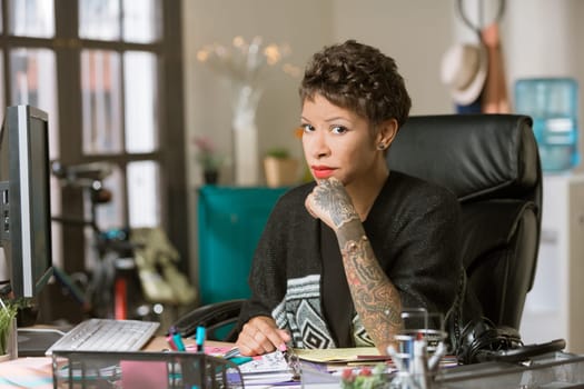 Skeptical professional woman in her office