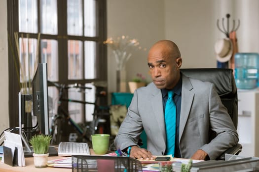 Skeptical professional man in his office