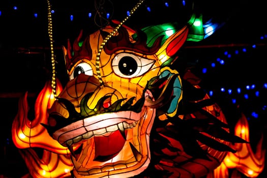 Face of an illuminated Asian dragon at a Chinese festival
