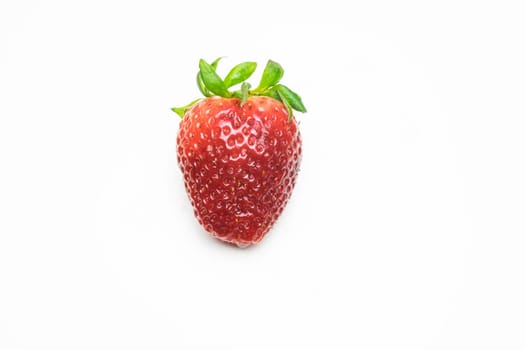 Isolated raw strawberry on a white background