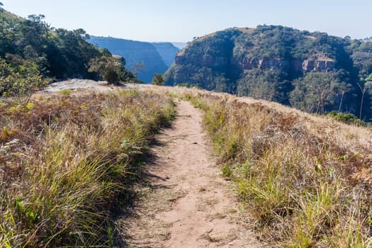 Kloof gorge overlooking rocky cliffs valley hills countryside hiking climbing landscape.