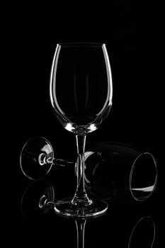 Empty wine glasses isolated on black background.