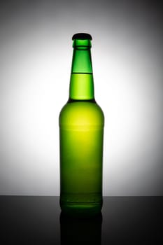 Green bottle of beer isolated on white background.