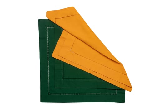 Closeup of a green and a yellow napkin or tablecloth isolated on white background. Kitchen accessories.