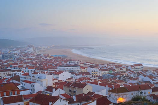 Skyline of Nazare - famous seashore Portuguese town at dusk. Portugal