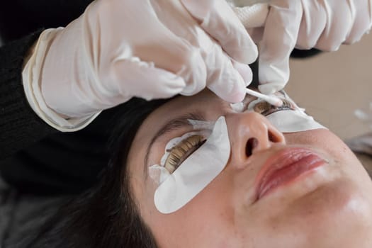 Cosmetic procedure of dyeing and lamination of eyelashes. Extension, perm, lamination of eyelashes. Eyelash care.