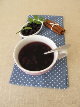 Warm blueberry soup from dried blueberries with cinnamon