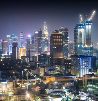 Jakarta city skyline with urban skyscrapers at night. Jakarta, Indonesia