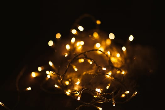 Christmas luminous garland on a dark background.