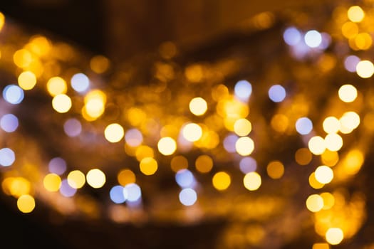 gold and silver bokeh on a dark background.