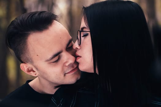 man and woman in the autumn forest