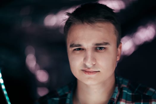 portrait of a young man on a blurred background.
