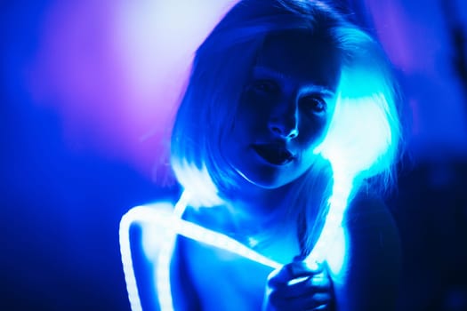 Portrait girl Strip Light LED tape on dark color background.