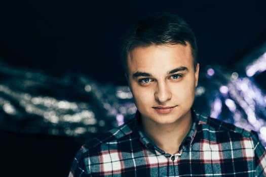 portrait of a young man on a blurred background.
