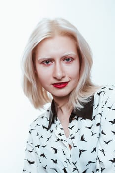 portrait blonde albino girl in studio on white background.