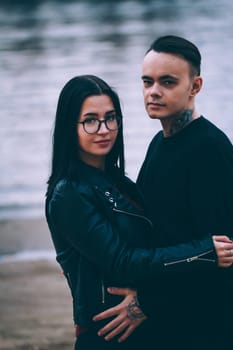 man and woman near the river autumn.