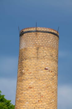 Old factory chimney from brick dark dramatic clouded sky, Lubeck, Schleswig-Holstein, Germany, Europe