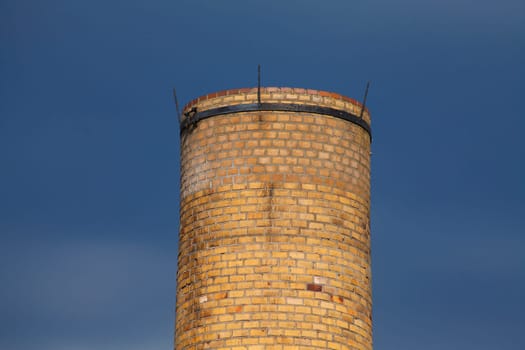 Old factory chimney from brick dark dramatic clouded sky, Lubeck, Schleswig-Holstein, Germany, Europe