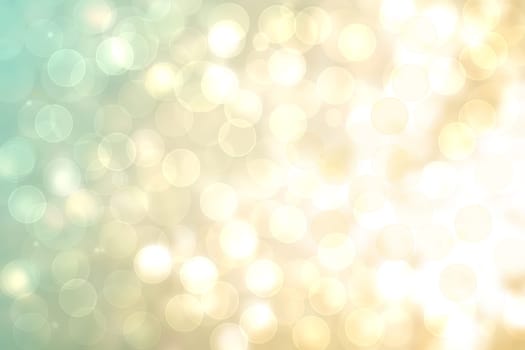 A festive abstract golden turquoise gradient background texture with glitter defocused sparkle bokeh circles. Card concept for Happy New Year, party invitation, valentine or other holidays.