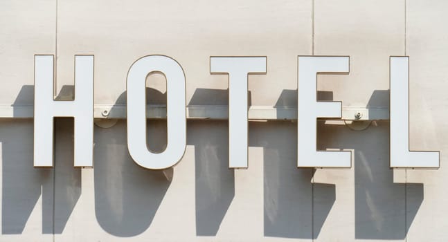 White hotel sign with shadow, Germany, Europe