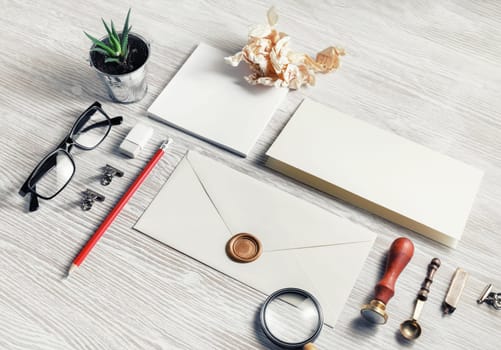 Blank retro stationery on light wooden background. Mock up for branding identity