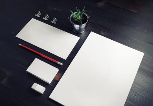 Blank corporate stationery set on wooden background. Template for branding design.