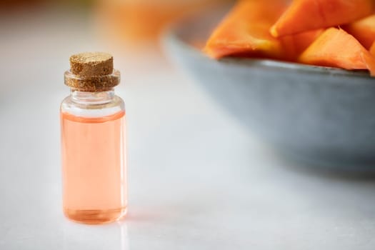 Small bottles of papaya extract with papaya fruit