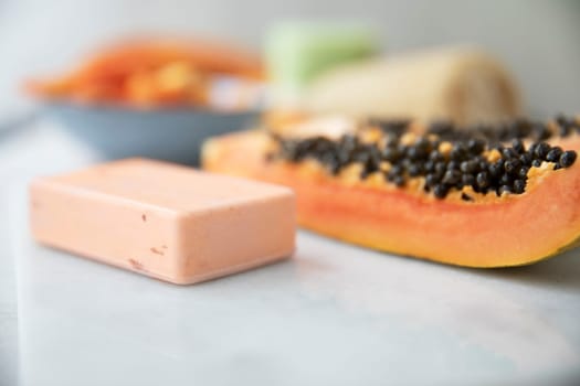 Bar of papaya extract soap with papaya fruit.