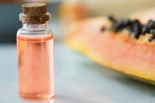 Small bottles of papaya extract with papaya fruit
