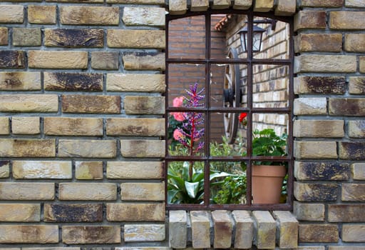 beautiful place in the garden in the mediterranean style, old window with flowers