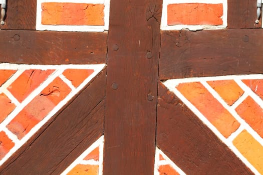 Brick wall with timber beam, Eutin, Holstein Switzerland, Schleswig-Holstein, Germany, Europe..