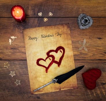 Antique preachment with written Happy Valentines Day, red candle, 2 cuddle hearts, painted hart, wooden decorations, detailed silver quill stand, ornamented silver quill on vintage oak