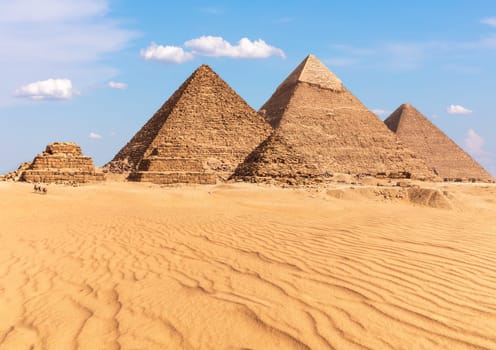 Complex of Giza Pyramids in Egypt, sunny day view.