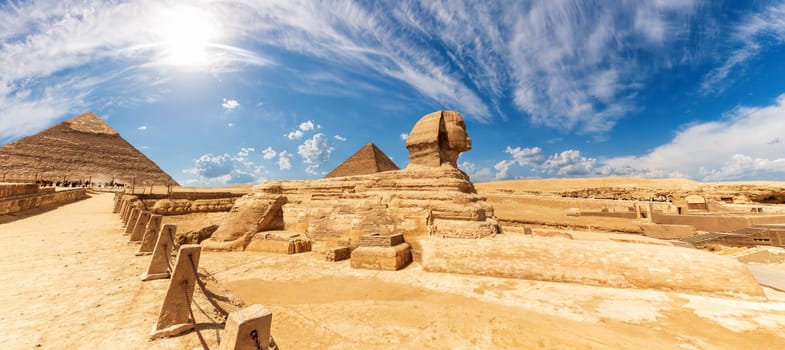 The Sphinx in front of the Pyramids, beautiful panoramic view.