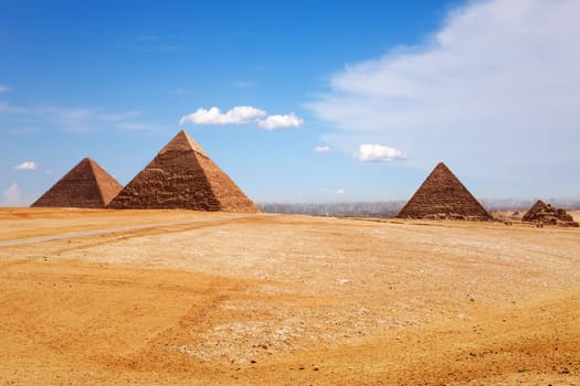Sunny day in Giza desert, view on the Pyramids.