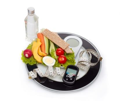 Still life with healthy food, scales, measuring tape and blood glucose meter on white background. Concept: control of level glucose. Healthy lifestyle, healthy food, slimming