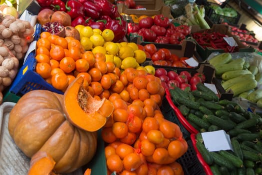 pumpkin and apelsins and other vegetables in sale in outdoor farmer market
