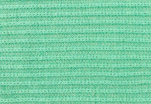 Green Knitting Texture or Knitted Texture Background in macro style. Knitting Texture or Knitted Texture in vintage style for design