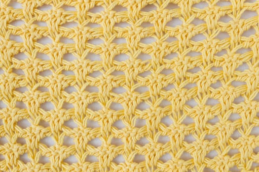 Dark Yellow Knitting Pattern or Knitted Pattern Background in macro style. Knitting Pattern or Knitted Pattern in vintage style for design