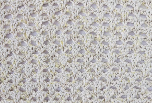 Yellow Knitting Pattern or Knitted Pattern Background in macro style. Knitting Pattern or Knitted Pattern in vintage style for design