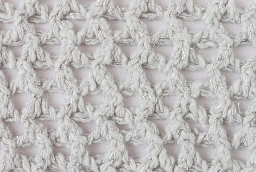 White Knitting Pattern or Knitted Pattern Background in macro style. Knitting Pattern or Knitted Pattern in vintage style for design