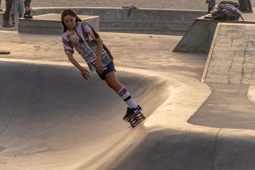 VENICE BEACH, CALIFORNIA - SEPTEMBER 30 : SKateboarder at the popular public skate board park at Venice Beach on September 30, 2018 in Los Angeles, California