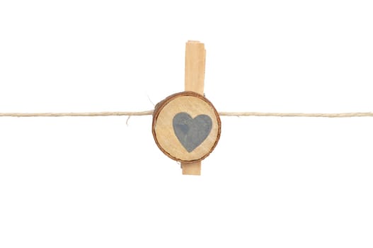 Twine and wooden peg on white background