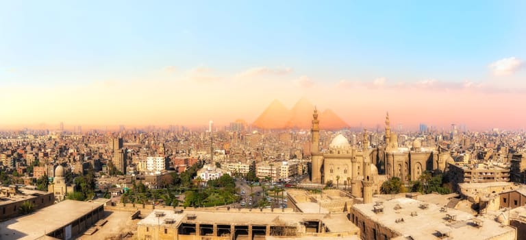 Sights of Cairo panorama: the Mosque-Madrassa of Sultan Hassan, the city view and the Pyramids.