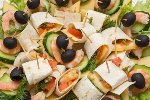 Konope snack on skewers, salad, cheese, shrimp and olive
