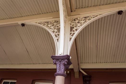 The Queensland cast iron verandah with Corinthian columns supporting the bull nose roof.