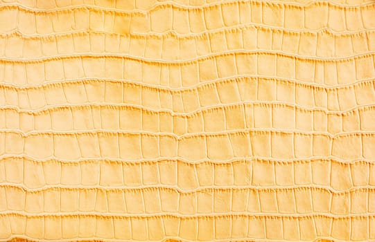 Yellow stylized imitation crocodile skin background
