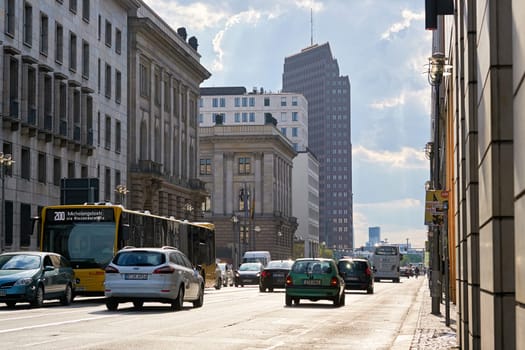 Road traffic on Leipziger Straße in Berlin during rush hour on a summer day