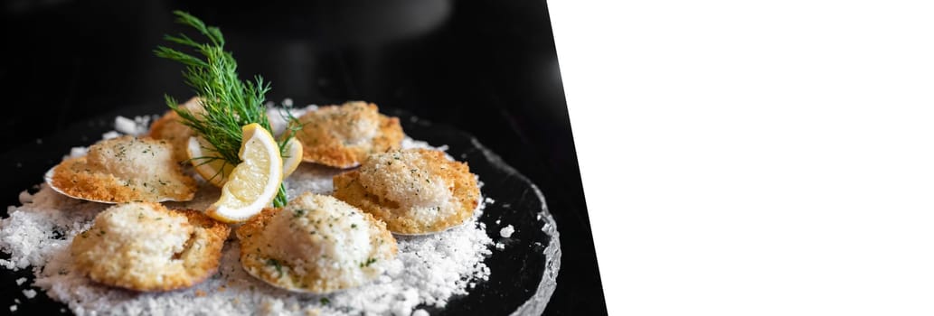 deep fried Hokkaido Scallops Shell with crusty bread serve with lemon and salt panoramic crop designed for using as web banner